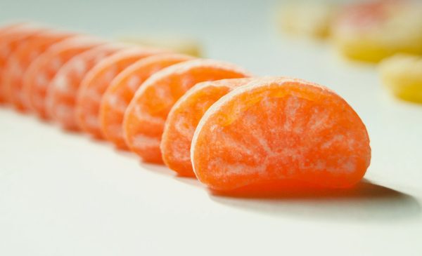 orange candies perfectly aligned